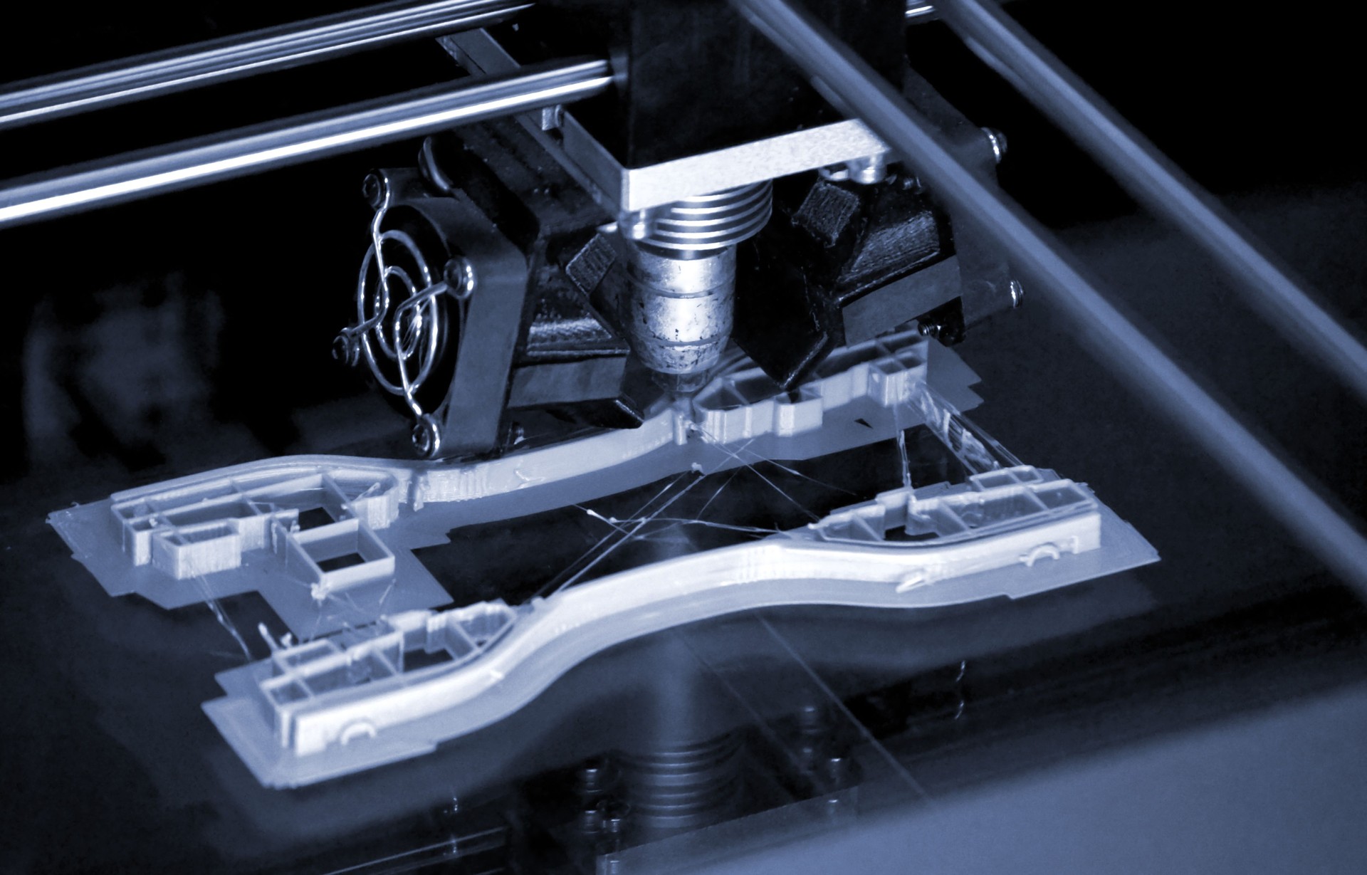 Printer printing gray objects on mirror reflective surface close-up top view